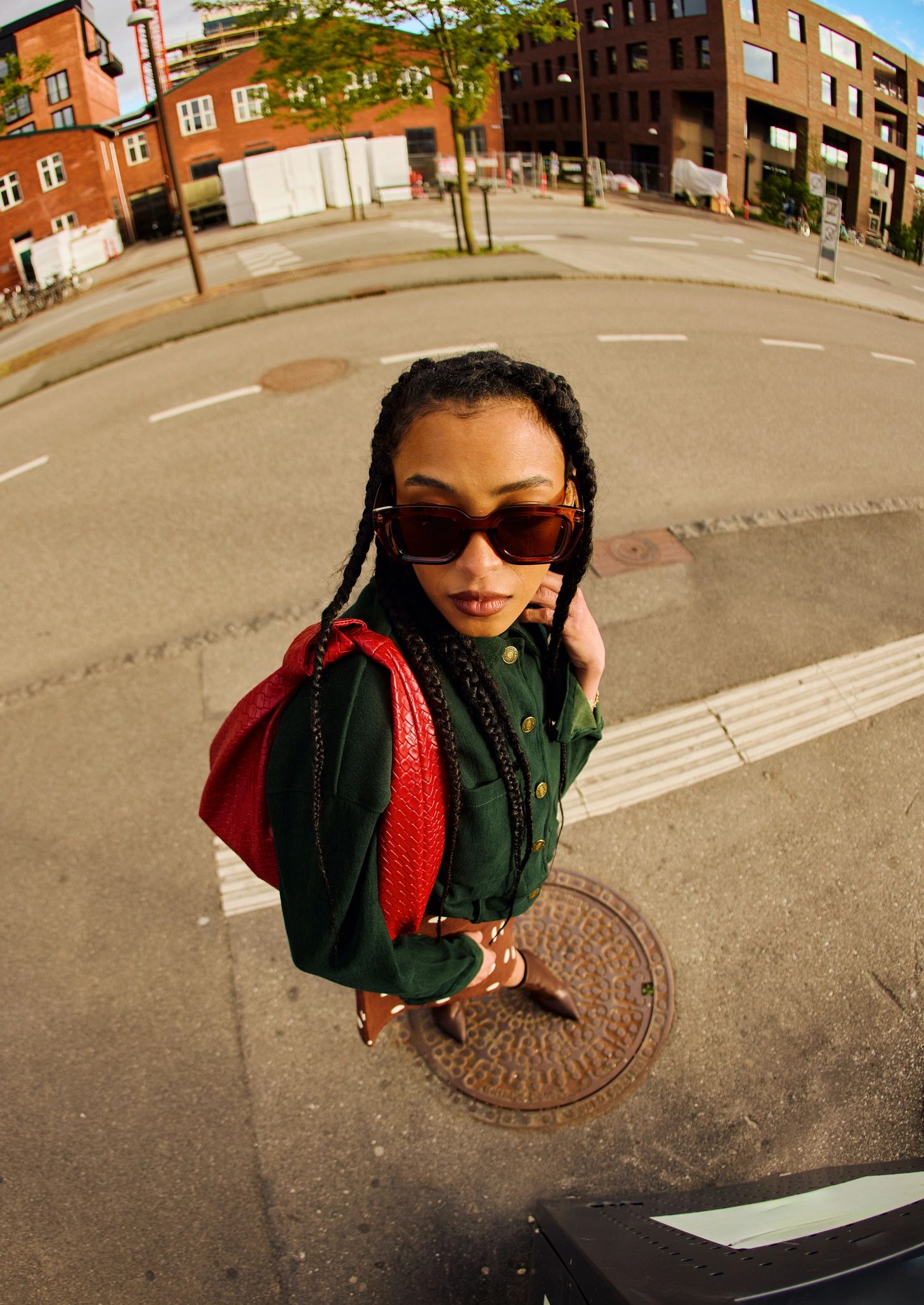 Fashionable young woman walking in a city street for editorial portrait inspiration