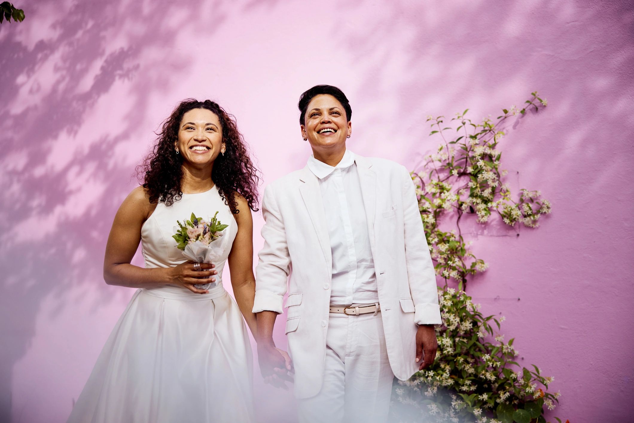 Newlywed couple standing together in wedding attire