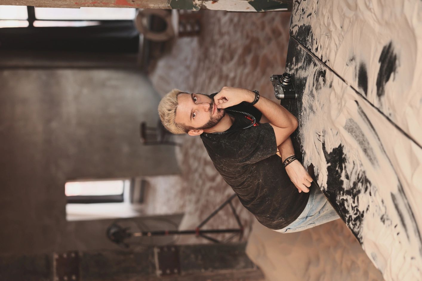 Editorial-style portrait of a woman in an industrial loft